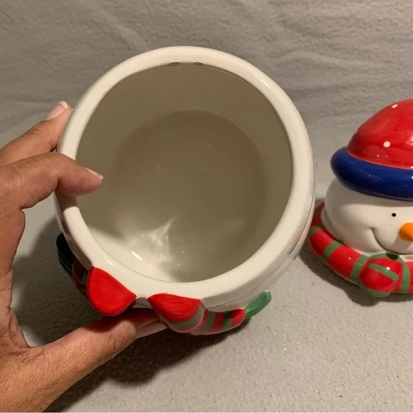 Holiday Snowman Cookie Jar with Santa’s red hat and red/green striped scarf. - Picture 8 of 8